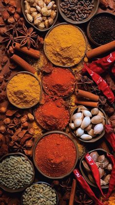 various spices and herbs are arranged in bowls