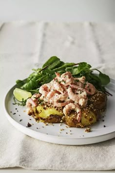 a white plate topped with food on top of a table