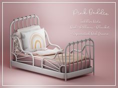 a pink bed with a white frame and pillow on it's headboard, in front of a pink background