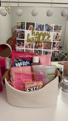 a white basket filled with personal care items on top of a counter next to a mirror