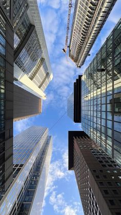 looking up at tall buildings in the city