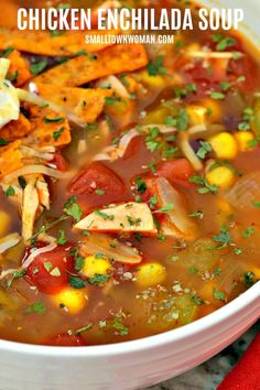 chicken enchilada soup in a white bowl on a red napkin with text overlay