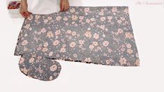 someone is making a flowered table runner out of fabric