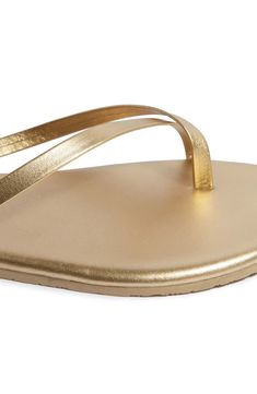 Shimmering metallic leather adds a luxe statement to this toe-loop flip-flop set on a lightweight, minimalist footbed serving all-day comfort. Water-resistant Leather upper and lining/rubber sole Made in Brazil Sleek Gold Sandals With Single Toe Strap, Sleek Gold Sandals For Summer, Gold Open Toe Synthetic Flip Flops, Sleek Metallic Sandals For Summer, Gold Leather Flat Flip Flops, Gold Toe Post Sandals With Cushioned Footbed, Gold Cushioned Flip Flops For Spring, Sleek Gold Leather Sandals, Adjustable Gold Open Toe Flip Flops