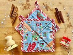 an origami clock on a wooden table next to other craft supplies