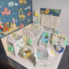 a doll house with furniture and accessories in it