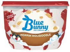 blue bunny ice cream is in the tub with red and white toppings on it