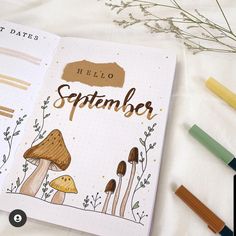 an open notebook with the words hello september written on it