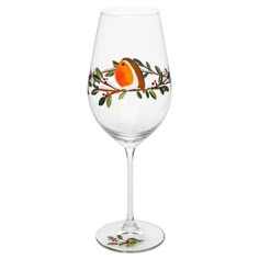 a wine glass with an orange bird painted on the side and green leaves around it