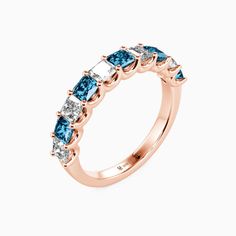 a rose gold ring with blue and white diamonds