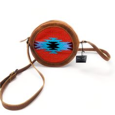 Dimensions: 9" x 2 1/4" Depth Handcrafted and Stunning. This eye catching western crossbody bag is meant for everyday functionality or that night out when you don't want to carry a large handbag. The beautiful 100% Buffalo Leather known for its durability, vintage look plus our Handwoven Wool Aztec Pattern stands out in a crowd and is sure to be a show stopper. This crossbody purse cantina is just the right size to become your perfect bag hands free. From day to night this bag is perfect! Comes Western Hand Tooled Travel Bag, Western Style Hand-tooled Travel Bag, Brown Southwestern Style Shoulder Bag For Everyday Use, Western Style Hand Tooled Shoulder Bag For Travel, Southwestern Style Crossbody Bag For Everyday Use, Southwestern Crossbody Bag For Everyday Use, Western Style Shoulder Bag For Everyday, Southwestern Hand Tooled Bags For Everyday Use, Southwestern Style Bag With Adjustable Strap