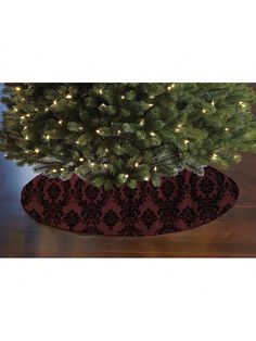 a christmas tree skirt with lights on it