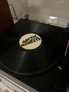 an old record player with the word arctic monkeys on it