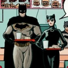 batman and catwoman standing in front of a fast food restaurant with the caption'i don't know what they are talking to each other