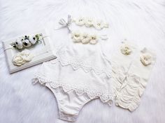 "OFF WHITE BOHO ROMPER Elegant super soft romper embellished with beautiful quality chiffon flowers with jewels and pearls. {use} *Birthday, *Baptism, *Easter, *special occasions, *picture props, *weddings, *for fun! Available dress sizes below: 0-6 months 6-12 months 12-24 months 2T CHOICE OF HEADBANDS-- #1 #2 #3 #4 Beautiful matching headbands adorned with jeweled flower and can be also made on hard headband or alligator clip. If you need hard headband or on alligator clip, please leave a note Cream Bubble Romper With Ruffles For Baptism, Cream Ruffled Bubble Romper For Baptism, Spring Baptism Cream Bubble Romper, Elegant White Bubble Romper For Spring, White Fitted Bubble Romper For Baptism, Cute Cream Baptism Dress For Summer, White Bubble Romper For Baptism In Summer, White Bubble Romper For Baptism In Spring, White Bubble Romper For Baptism And Spring