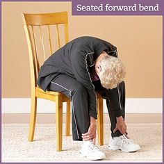 a woman sitting on a chair with her head in her hands and the words seated forward bend