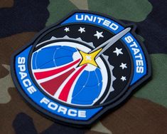 the united states space force logo on a camo jacket