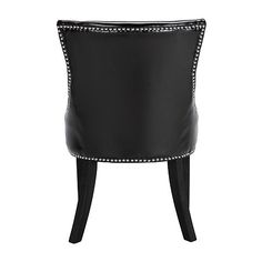 a black leather chair with studded legs