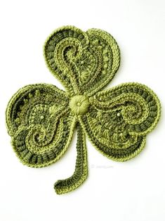 a crocheted shamrock is shown on a white surface