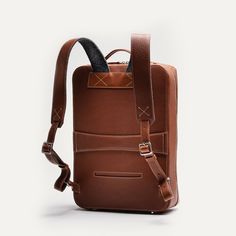 Our Giani backpack is above all compact and elegant. It offers minimalist curves, designed to optimize storage inside the bag. In terms of construction, as with the entire Giani range, we have combined our smooth leather with our grained leather: two semi-vegetable tanned leathers that will acquire a patina over the years.

The GIANI backpack will be delivered to you in a protective pouch. Modern Leather Backpack With Smooth Grain, Modern Rectangular Backpack With Smooth Grain, Modern Smooth Grain Leather Rectangular Backpack, Brown Leather Backpack For Formal Occasions, Formal Brown Leather Standard Backpack, Formal Brown Leather Backpack, Modern Textured Leather Travel Backpack, Modern Leather Backpack For Formal Use, Modern Formal Leather Backpack