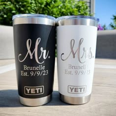 two personalized yeti tumblers sitting next to each other