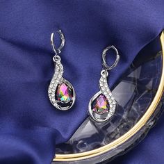 Colorful Lightweight Easy To Wear All Day Earrings. Versatile And Pair Well With Multiple Outfits. Silver Crystal Dangle Teardrop Earrings, Silver Crystal Teardrop Dangle Earrings, Elegant Rainbow Crystal Jewelry, Elegant Multicolor Nickel-free Crystal Earrings, Silver Sterling Teardrop Earrings With Sparkling Stones, Rainbow Jewelry With Sparkling Stones, Multiple Outfits, Crystal Dangle Earrings, Elegant Party