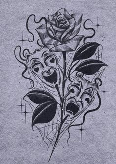 a black and white drawing of a rose on a gray shirt with an intricate design