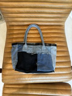 Upcycled custom denim tote bag -- superior denim utilized and custom made. Blue Denim with Genuine Brown leather bottom and Italian leather black brim. Rolled denim handles. Custom Denim, Denim Tote Bags, Denim Tote, Hand Bag, Italian Leather, Leather Tote, Blue Denim, Brown Leather, Custom Made