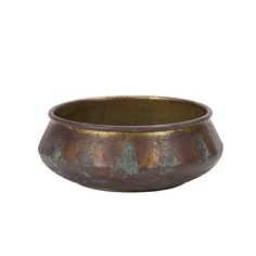 an old metal bowl on a white background