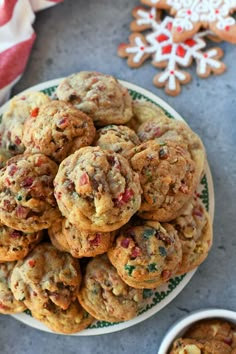 a plate full of cookies next to two small bowls