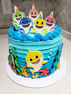 a birthday cake decorated with shark decorations