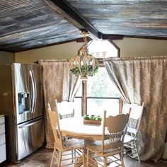 a kitchen with a table and chairs in it