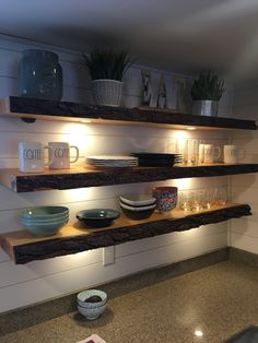 some shelves with bowls and plates on them