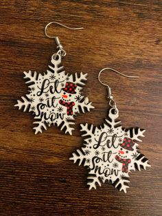 Let It Snow is a perfect pair of earrings for the snow and  snowman lover! Lightweight and easy to wear! Winter Holiday Drop Earrings, Holiday Winter Drop Earrings, White Jewelry For Winter Holiday, White Snowflake Earrings For Winter, Festive White Earrings For Winter, White Festive Earrings For Winter, Nickel-free White Earrings For Christmas, White Snowflake Earrings For Christmas, Snowman Earrings