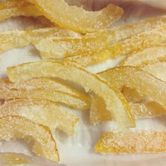 sliced orange peels sitting on top of a white plate