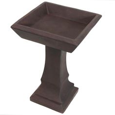 a brown pedestal with a square shaped base