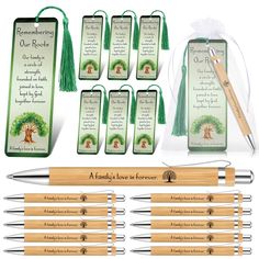 a set of six wooden pen and bookmarks with green tassels