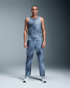 The performance-focused tank is ultra-lightweight and stripped down to the essentials for speed and comfort, ready for literally any run. Pared back to up your comfort. For the Performance Tank Top LOEWE, it's the absence of features that define its design. Crafted in practically weightless fabric for a next-to-naked feeling, this tank is so light you'll forget you're wearing it. How can a single layer house multiple wins? Effortlessly, in the Performance Tank Top LOEWE's case. The high-performance fabric is moisture wicking, quick drying and breathable, with bonded hems and seams to swerve skin irritations. All the speed, no distractions. Meet the layer that gets out of the way of your efforts, realized in exclusive LOEWE × On textured jersey. Features a distinctive tie-dye inspired print Functional Summer Activewear For Jogging, Blue Athleisure Tank Top For Running, Athleisure Activewear For Training With Dropped Armholes, Athleisure Activewear For Gym With Dropped Armholes, Sporty Compressive Blue Tank Top, Sporty Blue Compressive Tank Top, Blue Sporty Compressive Tank Top, Sporty Relaxed Fit Sleeveless Activewear, Sporty Sleeveless Activewear With Relaxed Fit