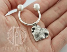 Your pets nose print or paw print preserved forever in fine silver with a sterling silver, threaded keyring. Shown is a custom nose print. Mold kit included. HOW IT WORKS:* A mold kit, as well as a pre-paid return label, will be shipped to you right away. (same or next business day)* Create the mold with the kit materials (instructions included)* Return the molds to me with the pre-paid label (if you are outside of the US, please see rules and regulations)* I'll handcraft your piece, engrave you Silver Paw Print Jewelry For Personalized Gift, Personalized Silver Jewelry With Paw Print, Silver Jewelry With Paw Print For Personalized Gift, Personalized Silver Keychain Gift, Sterling Silver Dog Tag Jewelry For Keepsake, Handmade Silver Keychains For Gifts, Handmade Silver Keychain For Gift, Handmade Silver Keychain As Gift, Dog Nose Print