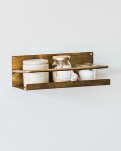 a shelf with some jars and containers on it