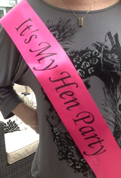 a woman wearing a pink sash with the words best and cheap on it