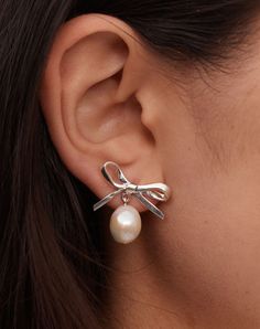 The greatest gift is to feel it all. The primness of pearls meets the uniformity of metal meets the unfussiness and fluidity of a simple bow form. Nostalgic in mood but modern in form. Feel It All, Simple Bow, Wallet Gifts, Bow Design, Feminine Design, Pearl Stud Earrings, Feel It, Pearl Studs, Last Minute Gifts