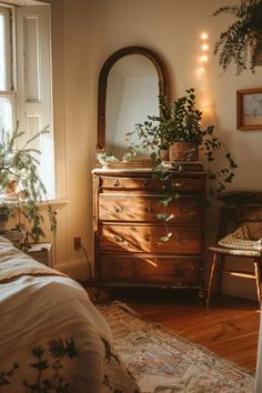 a bedroom scene with focus on the dresser and plants in the window, along with a chair