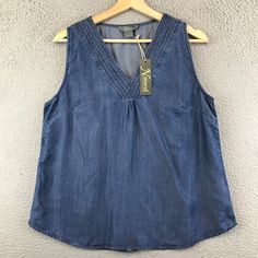 New Natural Reflections Womens Size L Sleeveless Chambray Blue Condition ~The Shirt Is New With Tag Attached. From Nonsmoking Environment. No Stains, Snags, Pilling, Odors, Or Excessive Signs Of Wear Unless Specifically Noted. Please See The Photo For Measurements. Shipping: Fast Shipping. All Items Will Be Shipped Within 1 Business Day Of Payment (Which Excludes Weekend And Holidays). Blue Stretch Denim Tank Top, Sleeveless Denim Blue Vest Top, Denim Blue Vest Top For Spring, Casual Sleeveless Medium Wash Top, Casual Medium Wash Sleeveless Top, Medium Wash Sleeveless Tank Top For Spring, Denim Blue Sleeveless Tank Top For Spring, Sleeveless Denim Blue Tank Top For Spring, Medium Wash Sleeveless Vest Top