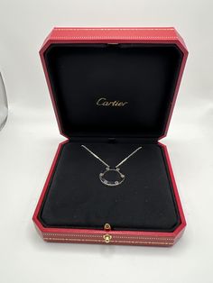 Genuine Cartier Love Collection Necklace. The necklace as well as the Original 16 inch chain are crafted of 18K White gold. The Piece is approximately 23.5mm wide and has a Gross Weight of 14.1 Grams. Hallmarked Cartier AU 750 and a Serial number. The necklace comes with the original inner and outer boxes and Cartier Certificate and is in very good condition. Would make a Great Addition to any Jewelry Collection Luxury Diamond Pendant Necklace For Anniversary, Luxury Sterling Silver Necklace For Anniversary, Exquisite Engraved White Gold Necklace, Luxury Clavicle Chain Pendant Jewelry, Round Necklaces With Polished Finish For Evening, Polished Round Necklace For Evening, Luxury Hallmarked Jewelry For Anniversary, Luxury Jewelry Pendant For Anniversary, Luxury Clavicle Chain Jewelry For Anniversary