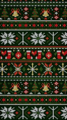 a green knitted christmas sweater with red and white ornaments