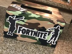 a camo box with the word fortte on it sitting on a counter top