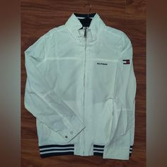 White Tommy Hilfiger Regatta Jacket Size Large Brand New, Never Worn Classic White Hooded Outerwear, Tommy Hilfiger White Long Sleeve Outerwear, Vintage Tommy Hilfiger Jackets, Tommy Hilfiger Windbreaker, Tommy Hilfiger Jacket, Fishing Vest, Mens Puffer Jacket, Hidden Hood, Tommy Hilfiger Vintage