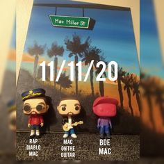 three pop - up figurines are displayed in front of a poster for mac miller street 11 / 11 / 20