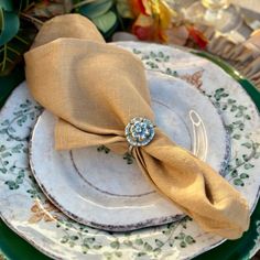 a table setting with plates, napkins and place settings on top of each other